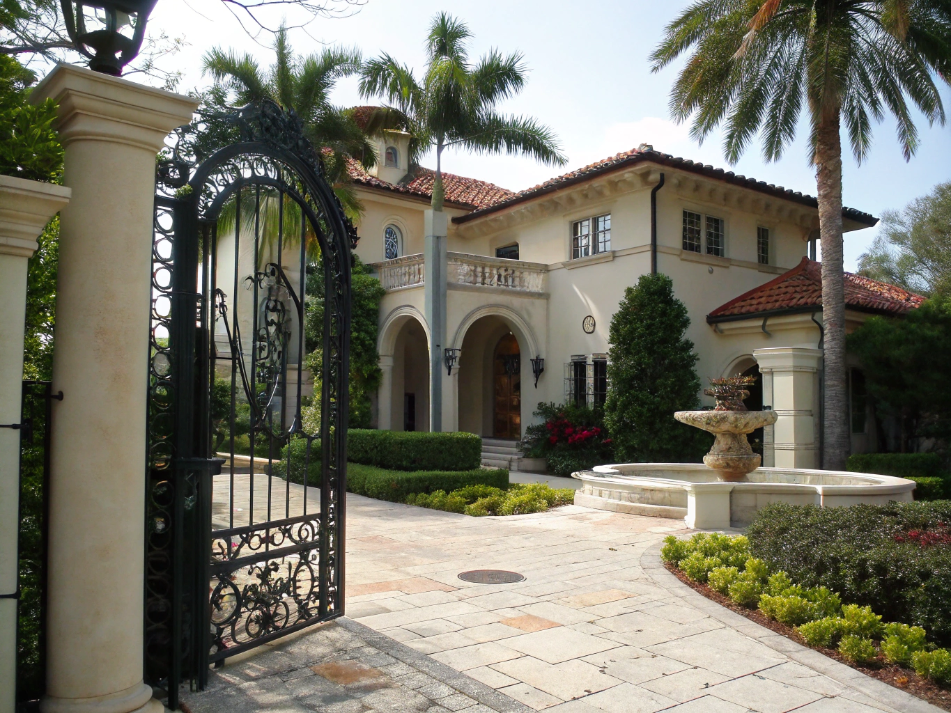 Exterior facade of a renovated Coral Gables historic home with lush landscape