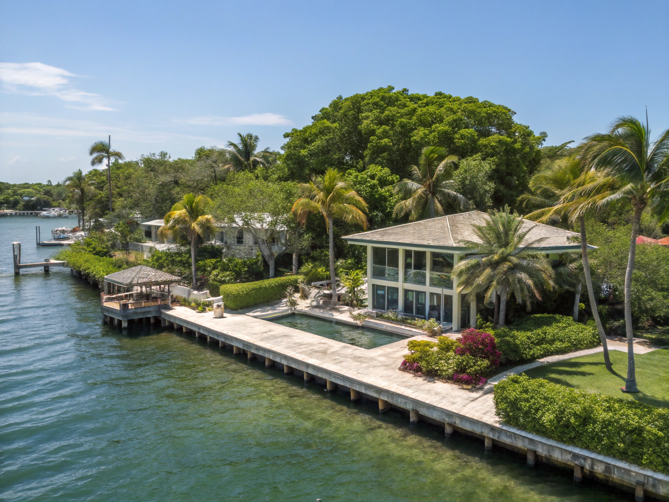 Lush tree-lined residential canopy and Biscayne Bay waterfront in Coconut Grove