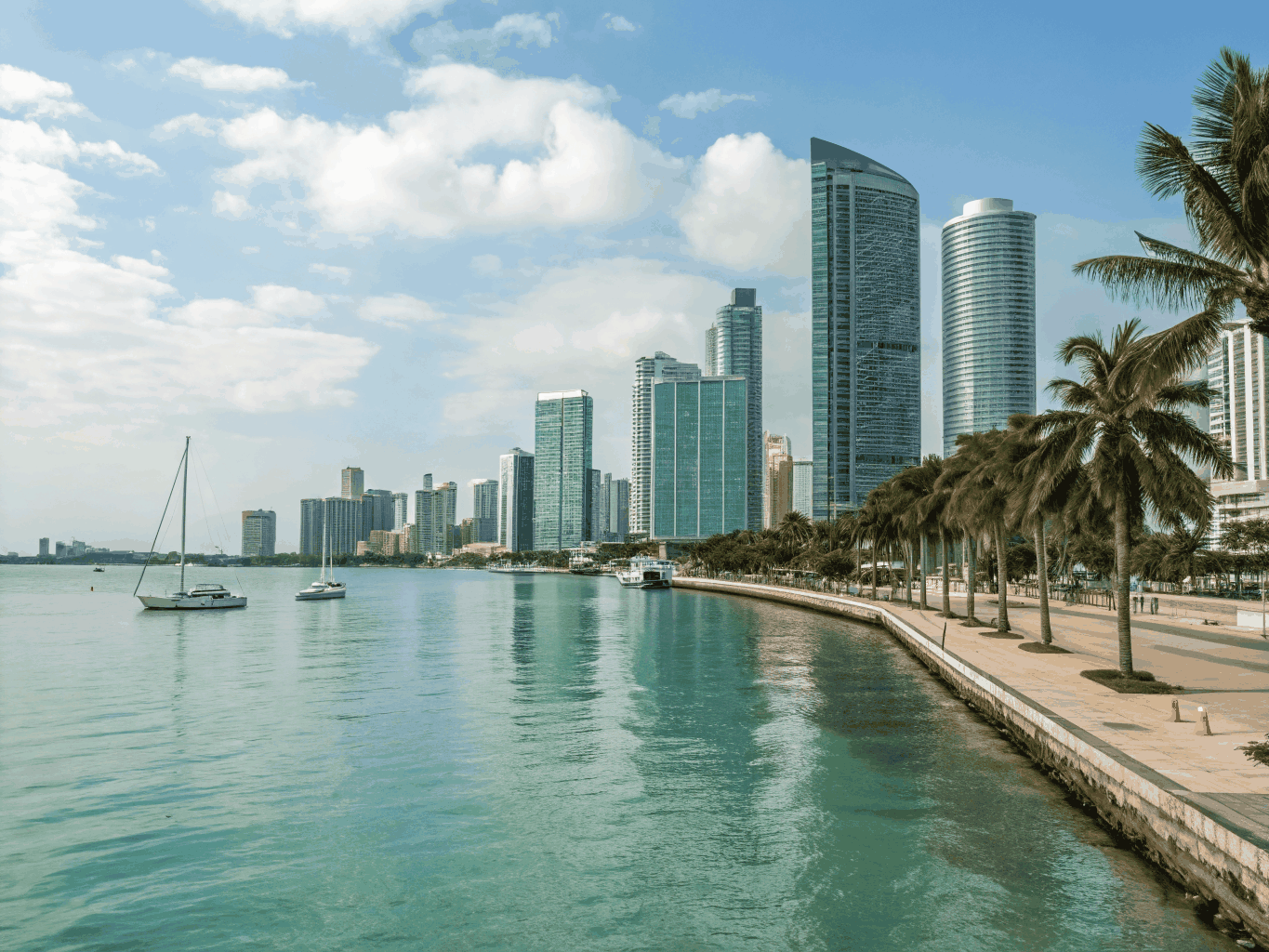 Downtown Miami urban streetscape with contemporary residential towers, historic architecture and vibrant avenues near Biscayne Bay