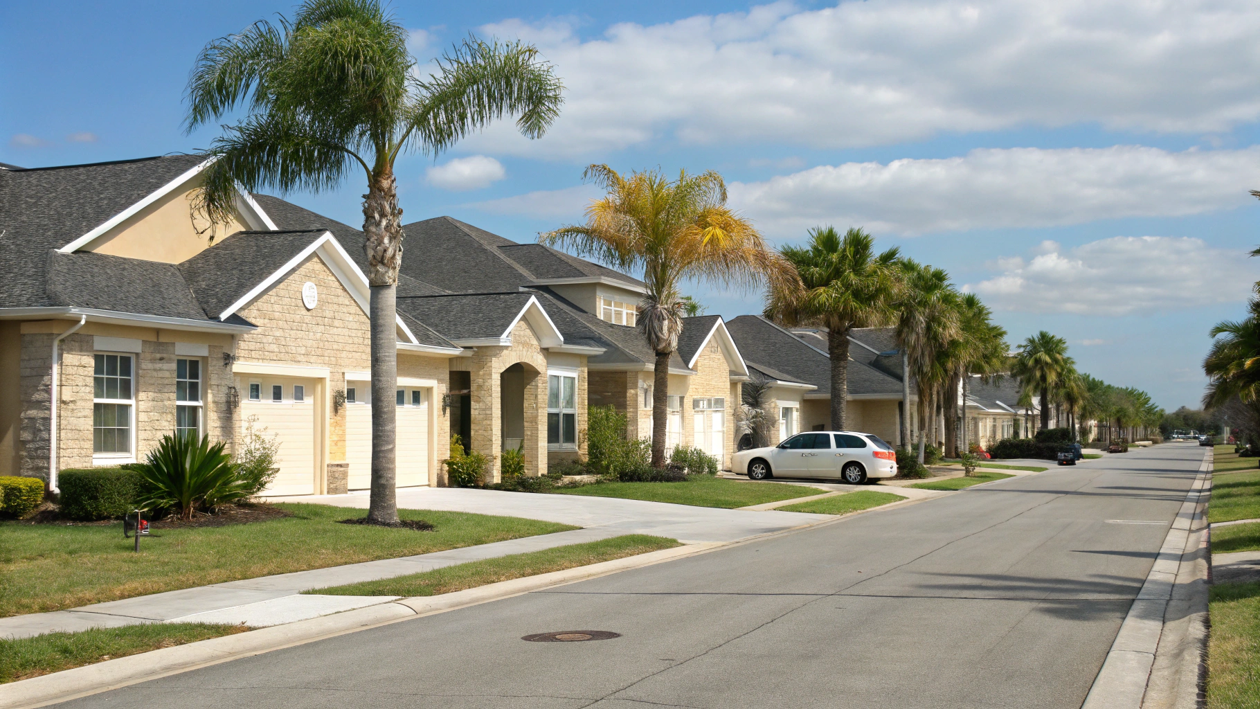 Tree-lined residential street with established single-family homes and lush tropical landscaping in Palmetto Bay